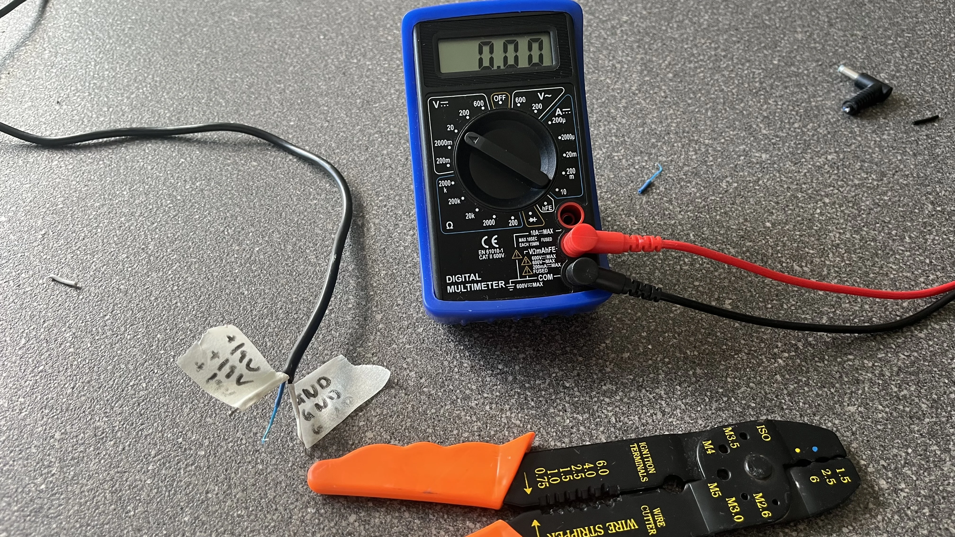 Laptop power supply cable split into positive and negative